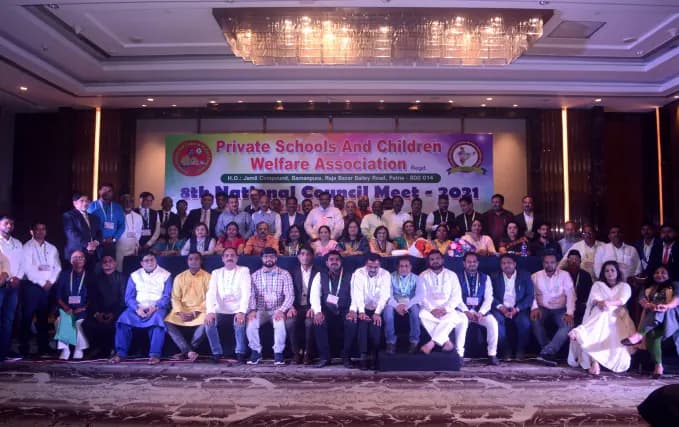 Group photo of delegates in a hotel ballroom at the 8th National Council Meet 2021